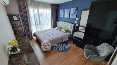 Modern bedroom with stylish decor, large window, and elegant furniture.