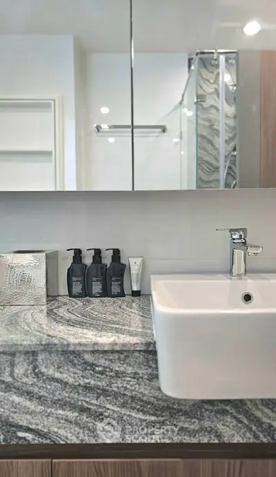 Modern bathroom with sleek sink and stylish granite countertop