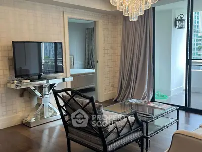 Luxurious living room with elegant decor and balcony view in high-rise apartment.