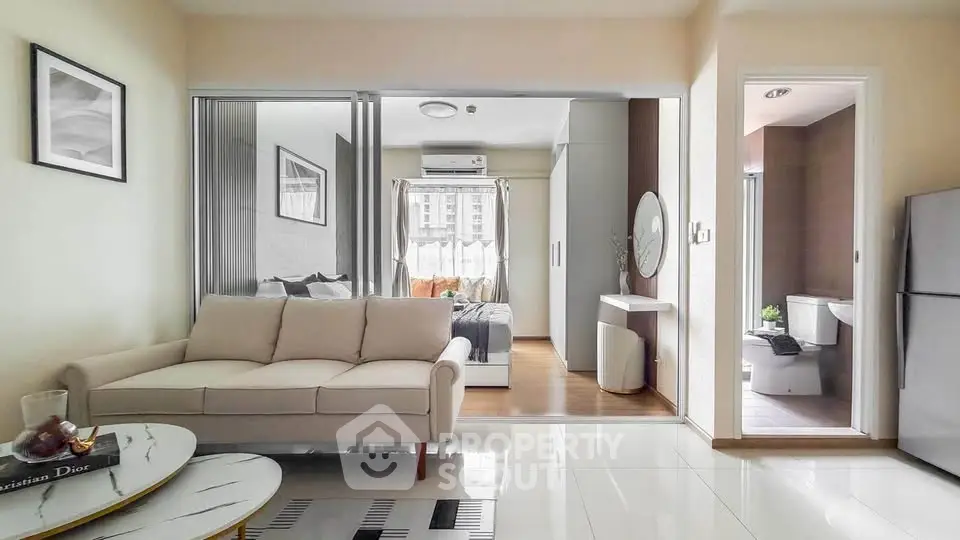 Modern apartment interior with living room, bedroom, and bathroom in open layout