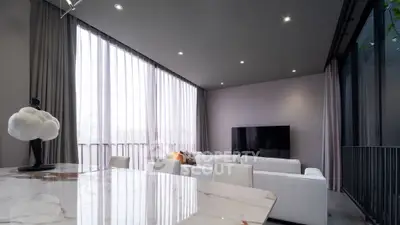 Luxurious modern living room with high ceilings and elegant decor