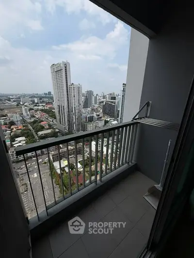 High-rise apartment balcony with stunning cityscape view