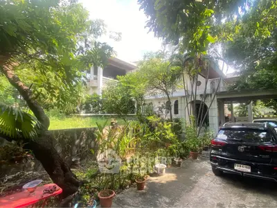 Charming residential property with lush garden and spacious driveway, perfect for serene living.