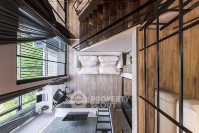 Modern loft-style living room with mezzanine and sleek design