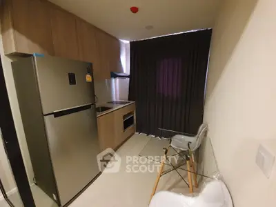 Modern compact kitchen with sleek appliances and stylish decor