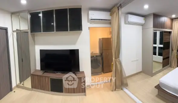 Modern studio apartment with sleek furniture and appliances