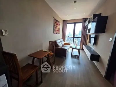 Modern living room with city view, featuring stylish furniture and wall-mounted shelves.