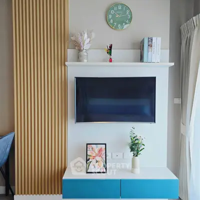 Modern living room with wall-mounted TV and stylish decor