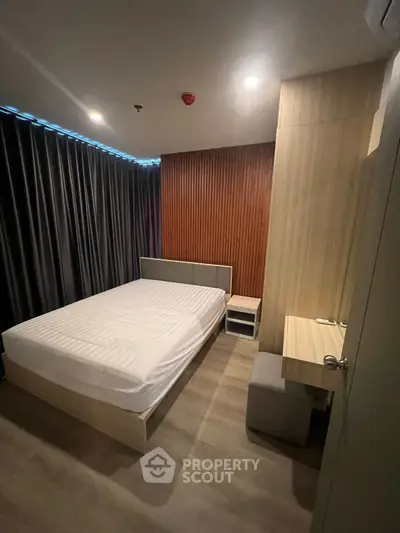 Modern bedroom with sleek design and ambient lighting