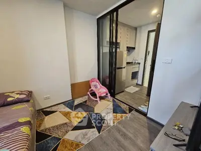 Modern apartment interior with stylish decor and compact kitchen area.