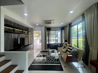 Modern living room with sleek design, large windows, and stylish decor in a contemporary home.
