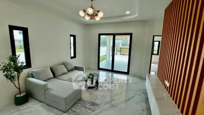 Modern living room with elegant chandelier and marble flooring