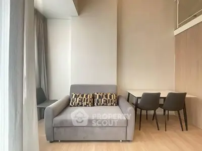 Modern living room with stylish sofa and dining area in a contemporary apartment