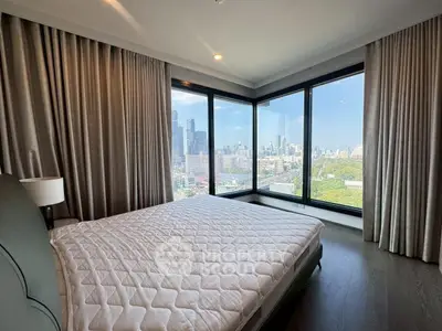 Luxurious bedroom with panoramic city view and elegant decor