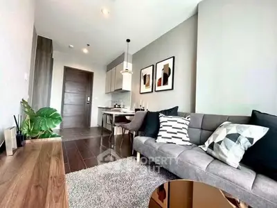 Modern living room with stylish decor and open kitchen layout in a contemporary apartment.