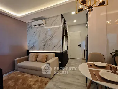 Modern living room with elegant decor and cozy dining area