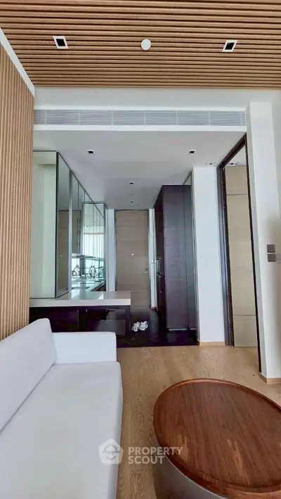 Modern living room with wooden accents and sleek furniture design