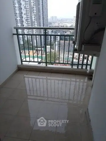 High-rise balcony with city view and air conditioning unit
