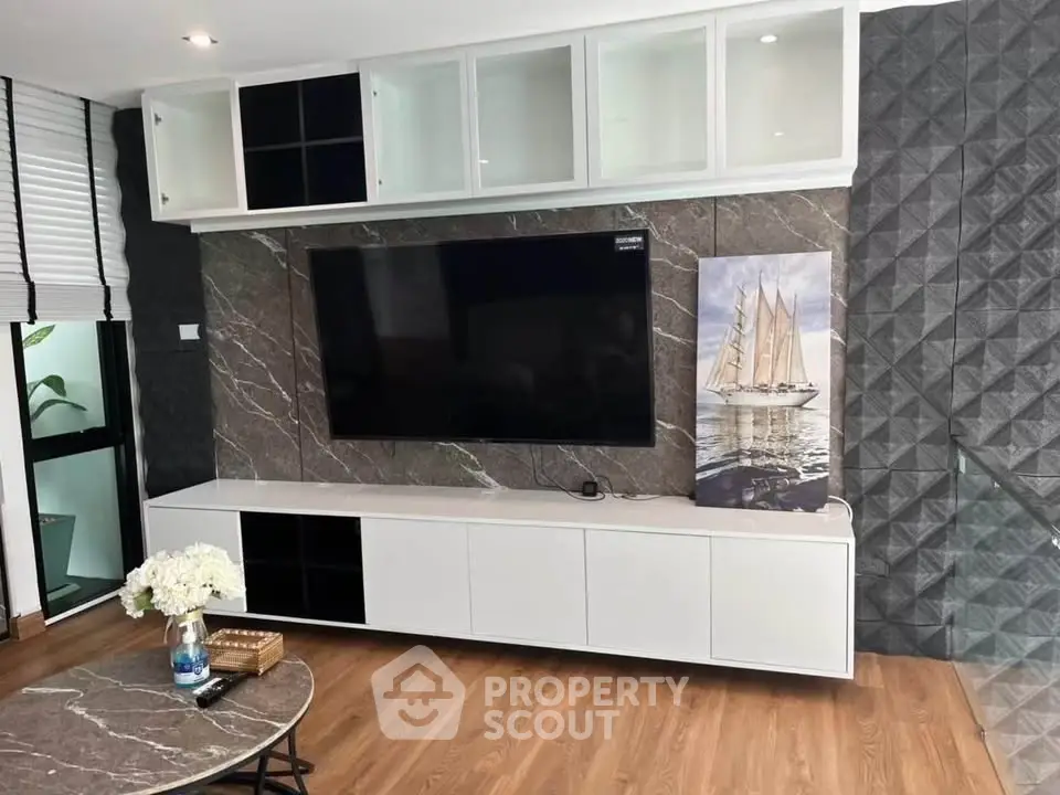 Modern living room with sleek TV setup and stylish decor