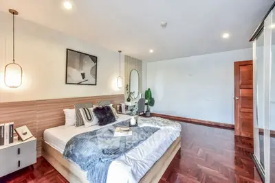 Spacious modern bedroom with elegant decor and cozy ambiance