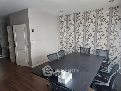 Spacious modern study room with elegant wallpaper and sleek furniture