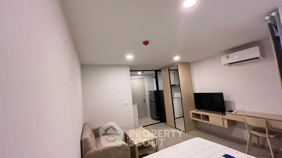 Modern apartment interior with cozy living area and sleek furniture