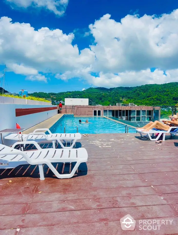 Luxurious rooftop pool with stunning mountain views and sun loungers for ultimate relaxation.