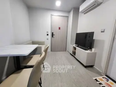 Modern living room with sleek furniture and air conditioning