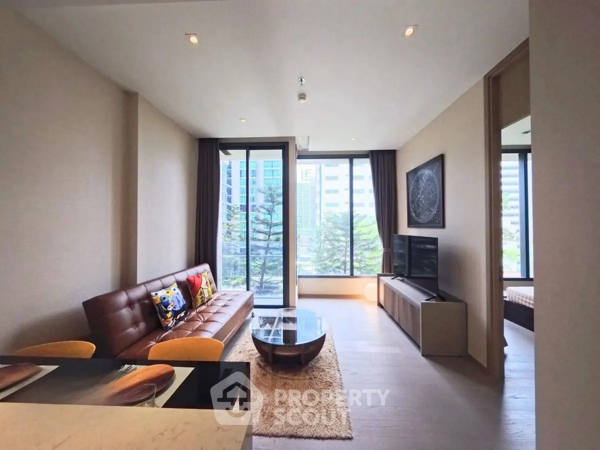 Modern living room with city view, stylish furniture, and natural light