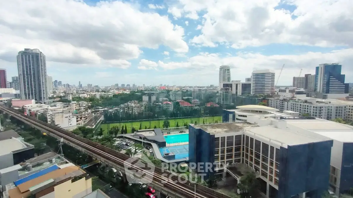 Stunning cityscape view with modern buildings and lush green spaces, perfect for urban living.