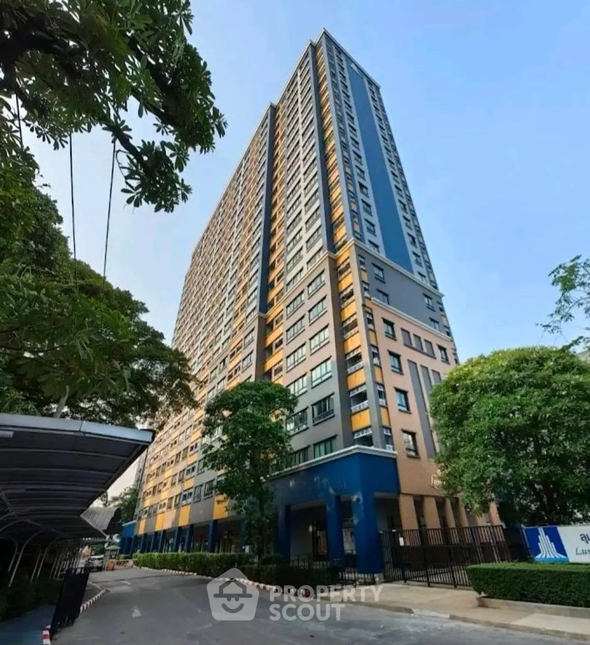 Stunning high-rise building with modern architecture and lush greenery