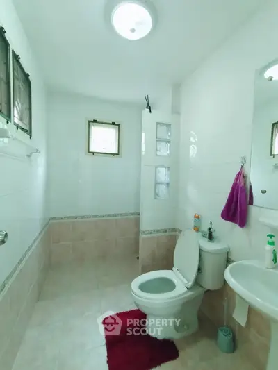 Spacious bathroom with modern fixtures and natural light