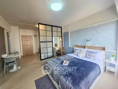 Spacious modern bedroom with stylish decor and cozy ambiance