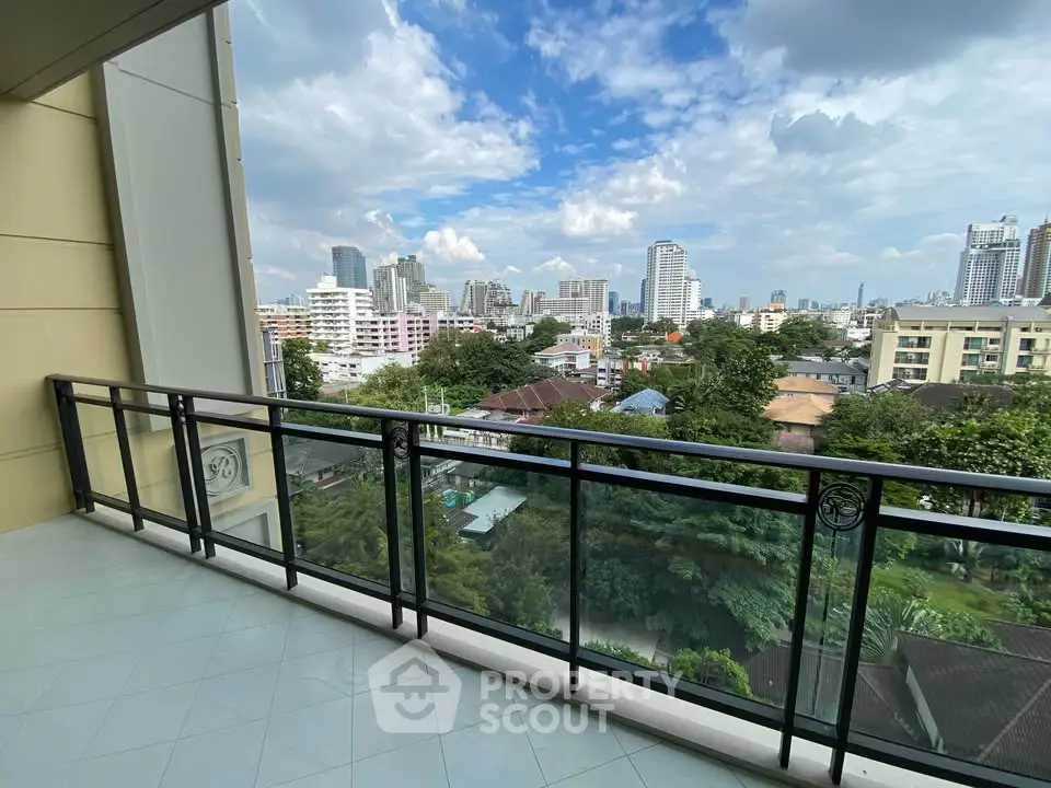 Spacious balcony with stunning city view in modern apartment
