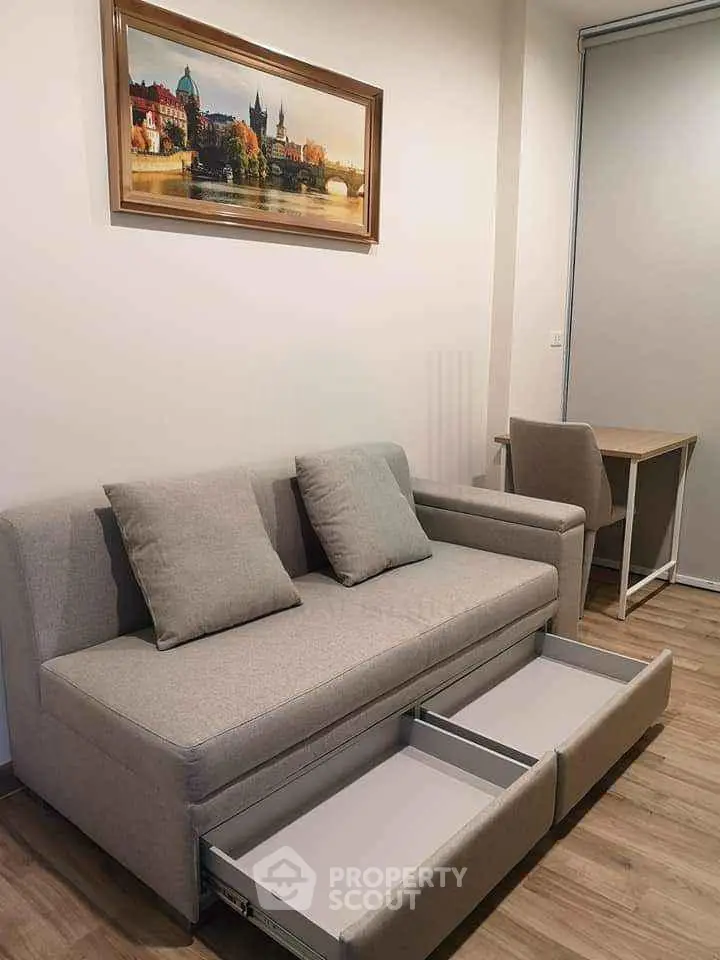 Modern living room with stylish sofa and functional storage drawers, perfect for urban living.