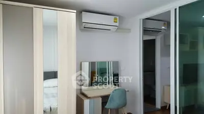 Modern bedroom with air conditioning and stylish furniture in a cozy apartment.