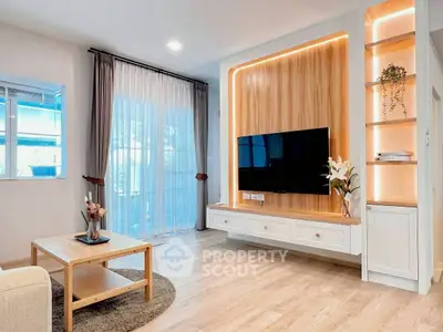 Modern living room with stylish wooden paneling and large TV