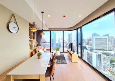 Stunning modern living room with panoramic city views and elegant decor
