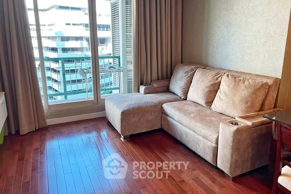 Stylish living room with cozy sofa and city view from window