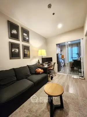 Cozy living room with modern decor and open view to adjacent room