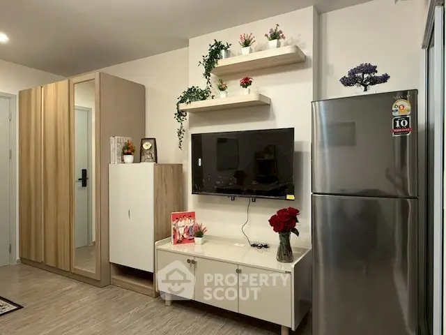 Modern living room with wall-mounted TV and sleek storage solutions