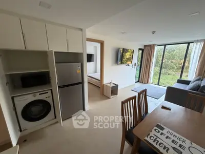 Modern open-plan living room with kitchen and garden view