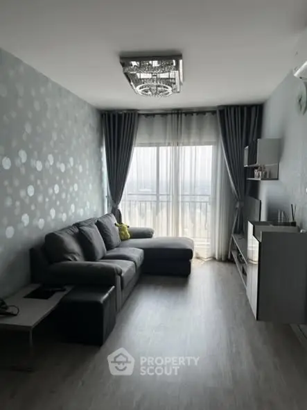 Modern living room with stylish decor and large window view