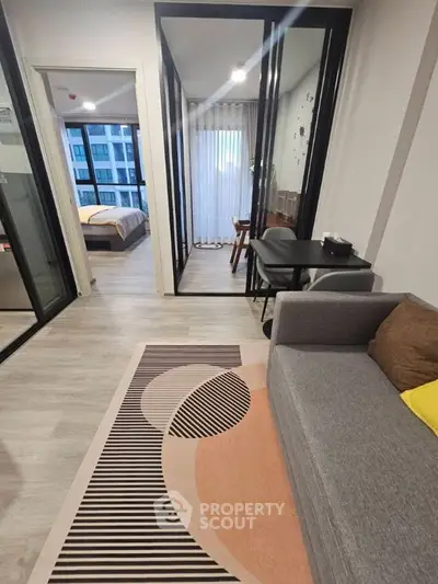 Modern apartment interior with stylish living room and cozy bedroom view.