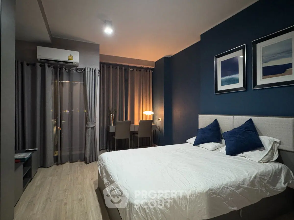 Modern bedroom with stylish decor and cozy lighting