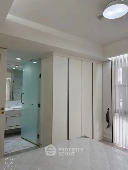 Modern bedroom with ensuite bathroom and sleek design