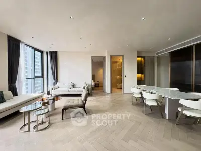 Luxurious modern living room with elegant furniture and large windows offering city views.