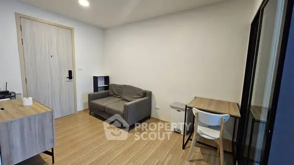 Modern minimalist living room with cozy sofa and dining area