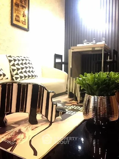 Stylish modern living room with chic decor and cozy seating area.
