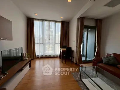 Spacious living room with city view, modern furnishings, and natural light